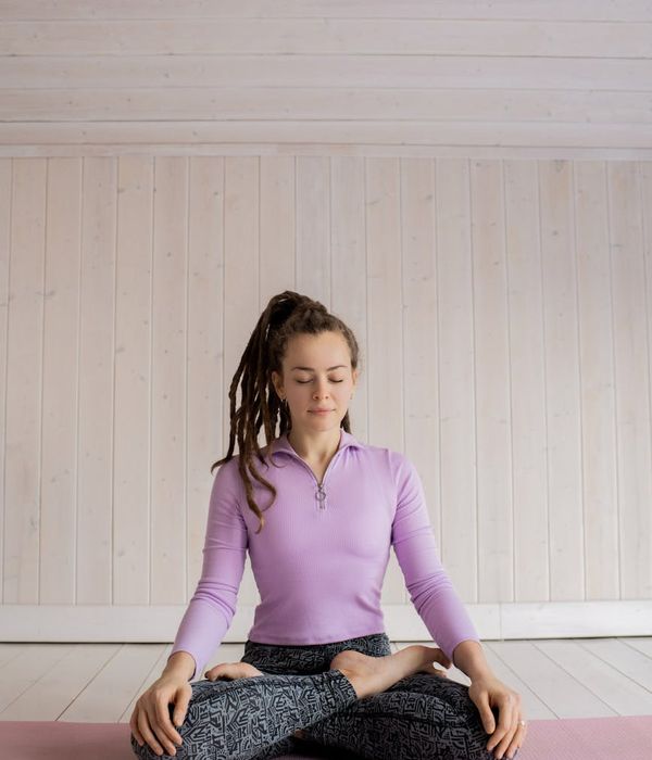 Woman in a peaceful yoga pose focusing on inner stability